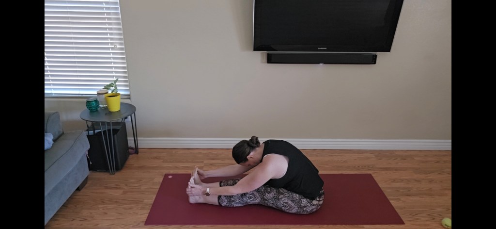 Seated Forward Fold beginner yoga pose for flexibility and release
