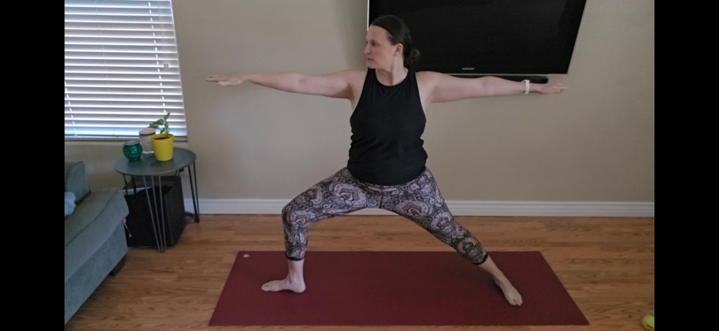 Warrior II beginner yoga pose for strength and focus