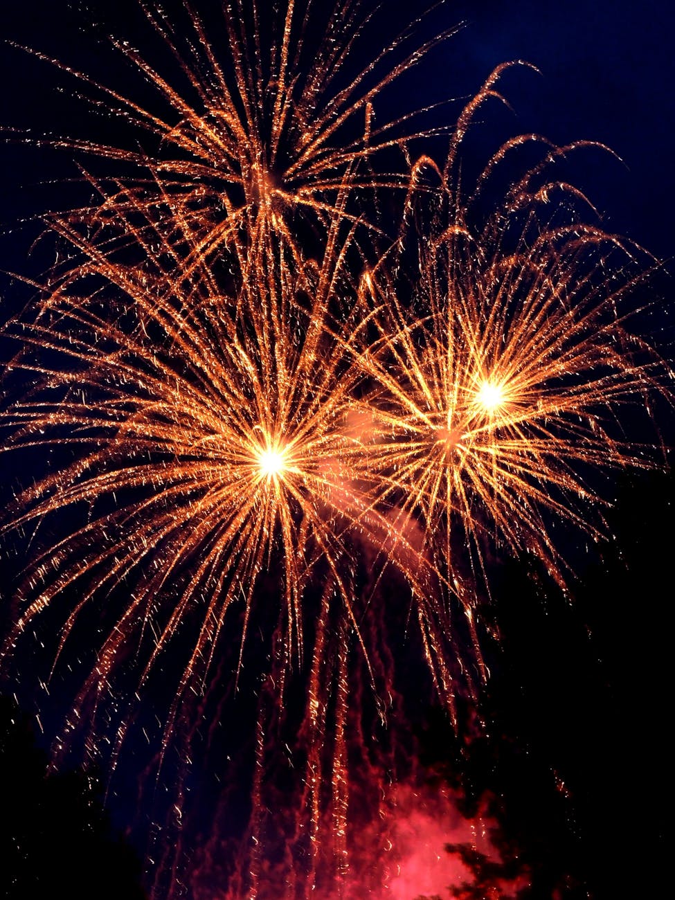 Fireworks lighting up the night sky, symbolizing the transition into the New Year and the practice of letting go.
